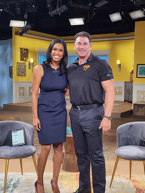 Phoenix Pest Management and Wildlife Control Owner Posing With TV Show Host