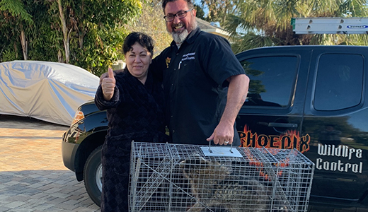 Wildlife Removal in New Port Richey Florida New Port Richey Homeowner Posing Beside Pest Control Who Removed Wildlife From Her House